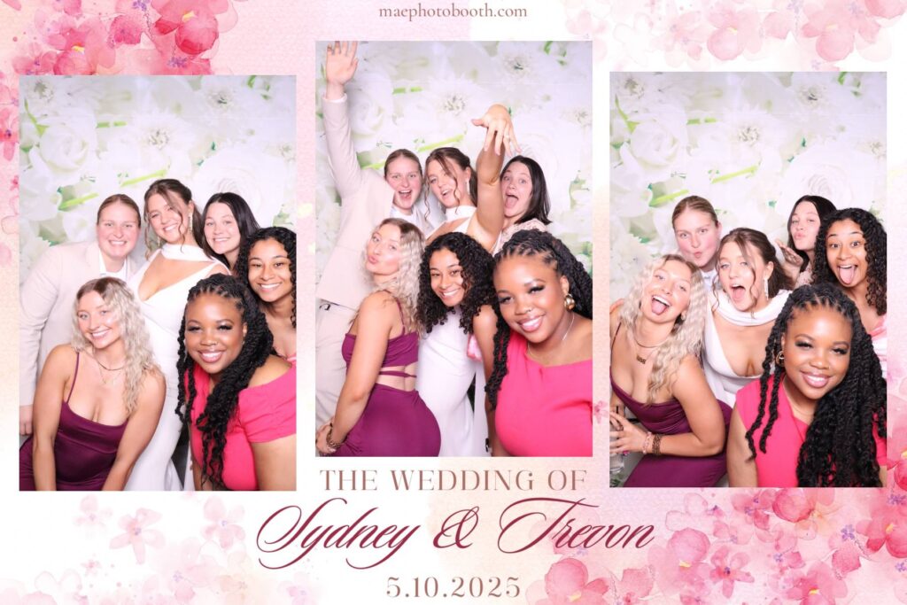 Sydney and Trevon enjoying their wedding event with mae photo booth LLC setup